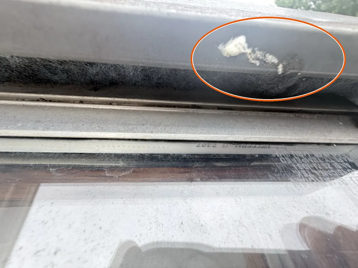 Dents in the gutters or other soft metal, circled on a C&N Construction job photo in Arlington Heights, IL