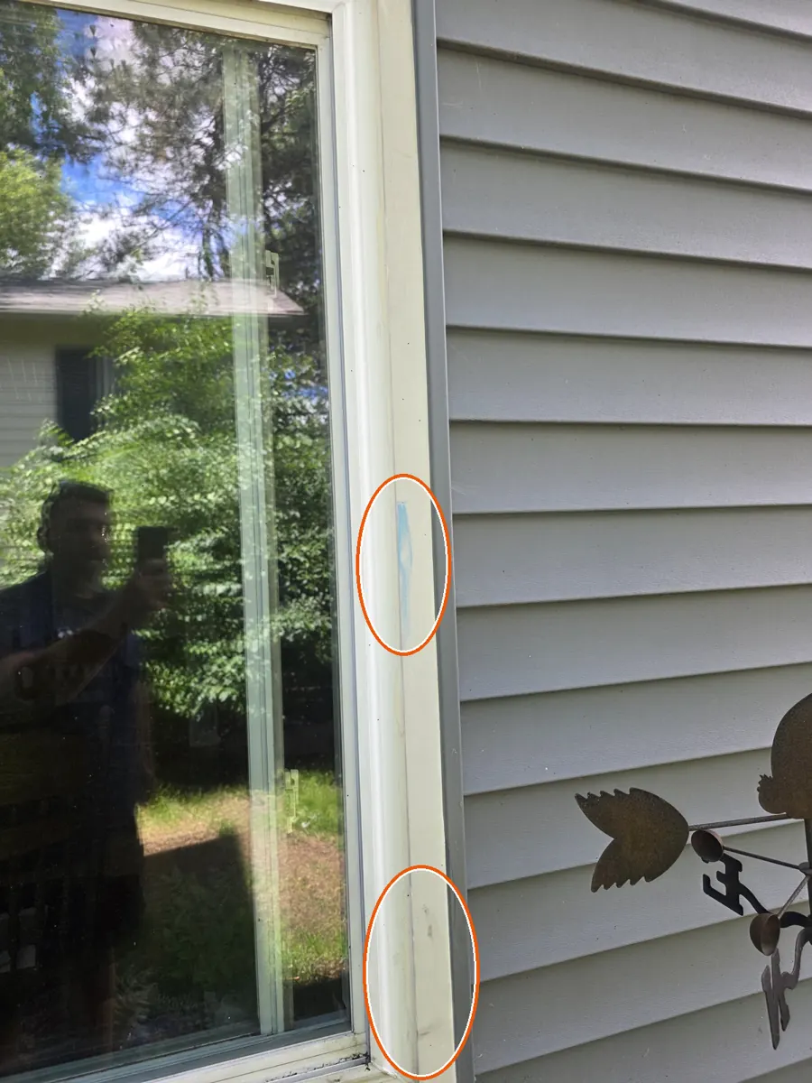Hits on the siding or window screens, circled on a C&N Construction job photo in Hanover Park, IL