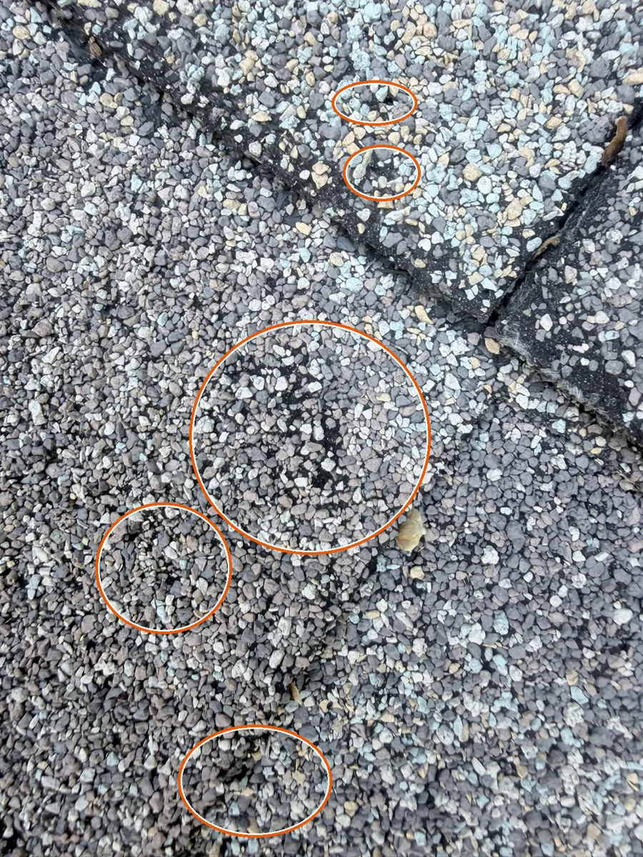 Round, scattered bruises, circled on a C&N Construction job photo in Burr Ridge, IL