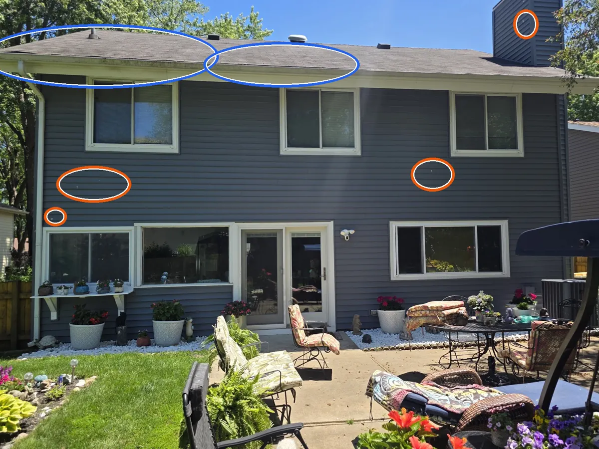 Lifted tabs, and hits on the siding or window screens, circled on a C&N Construction job photo in Hanover Park, IL