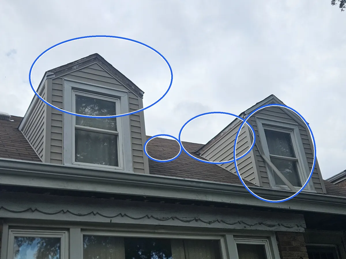 Missing shingles, circled on a C&N Construction job photo in Chicago, IL