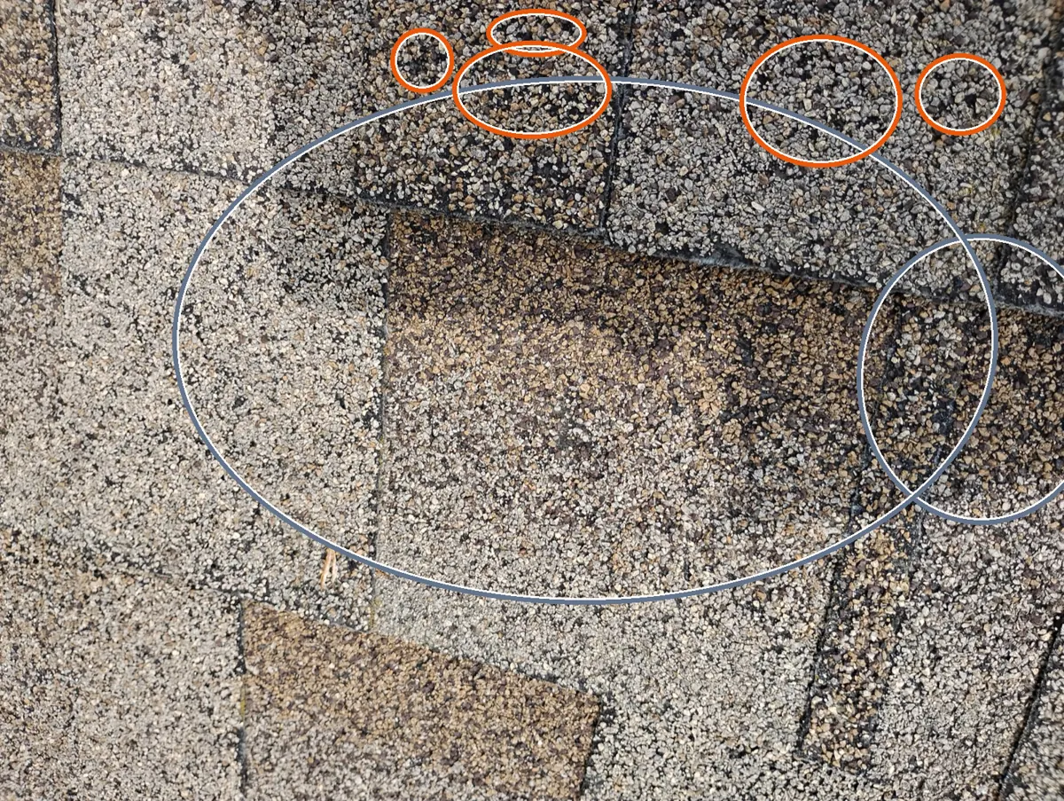 Round, scattered bruises, circled on a C&N Construction job photo in Lombard, IL