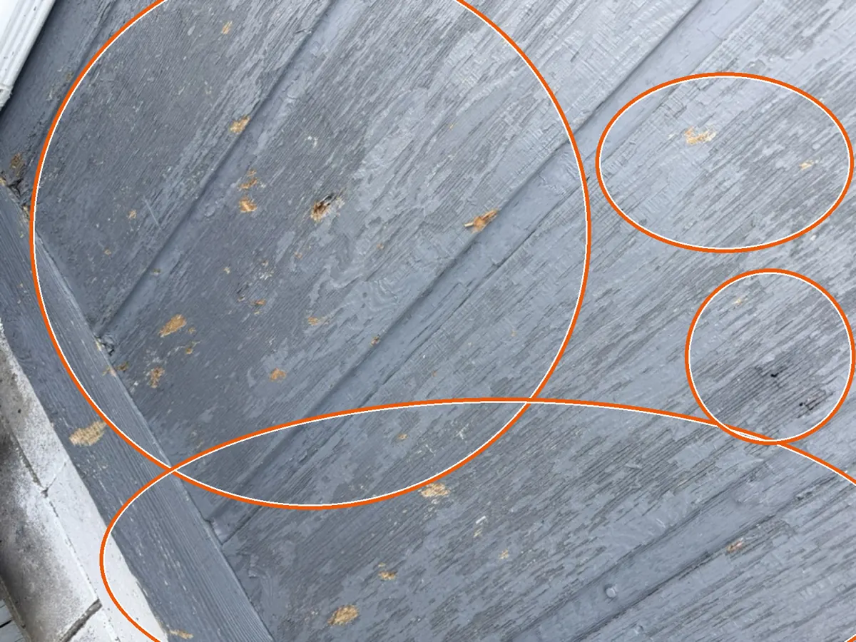Fresh splits in the wood shakes, circled on a C&N Construction job photo in the Chicago suburbs