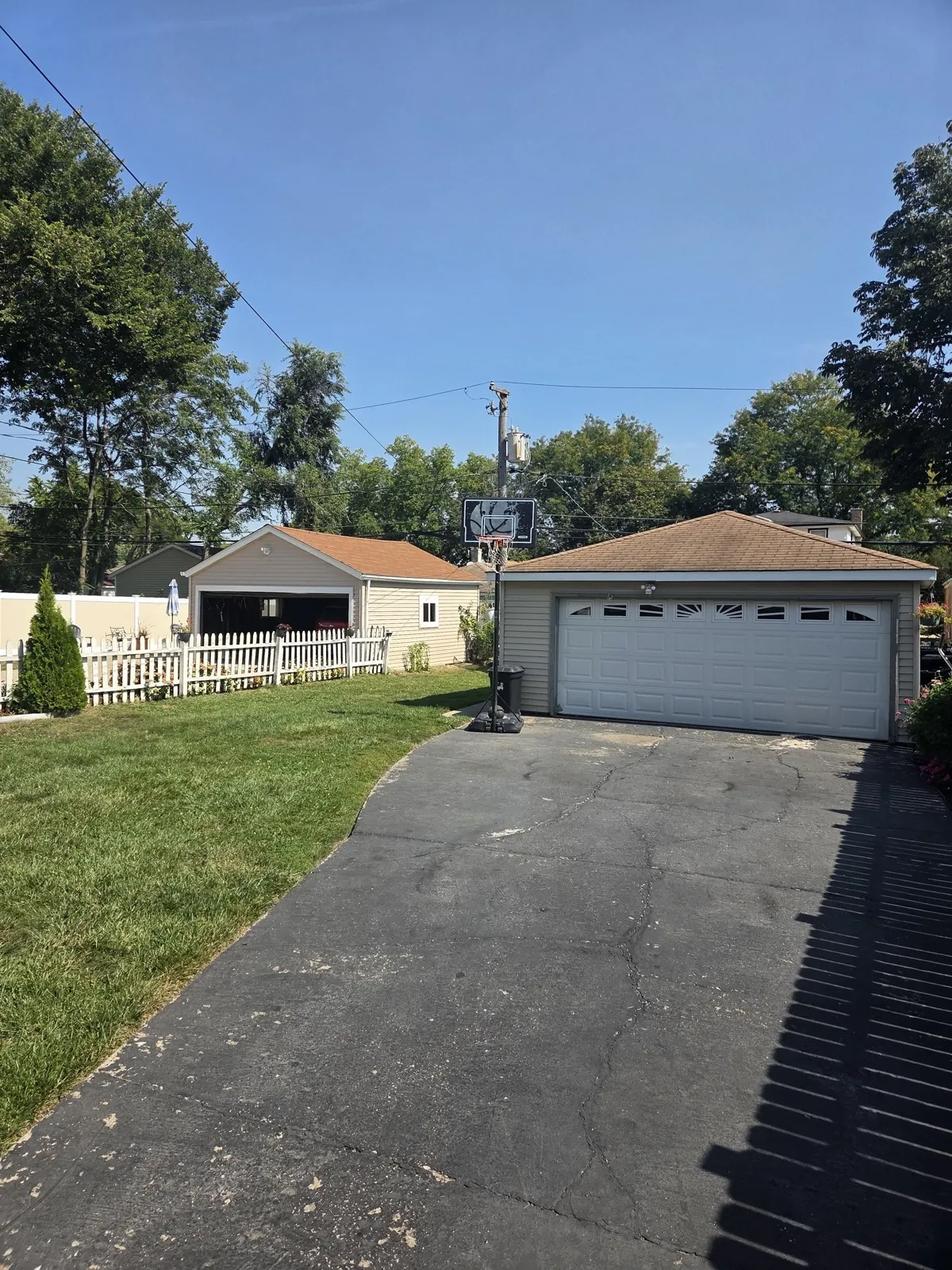 New brown architectural shingle roof on a garage and house in Bellwood, IL