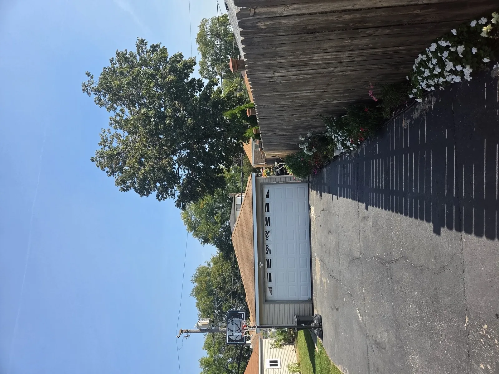 New asphalt architectural shingle roof on a house with a garage in Bellwood, IL