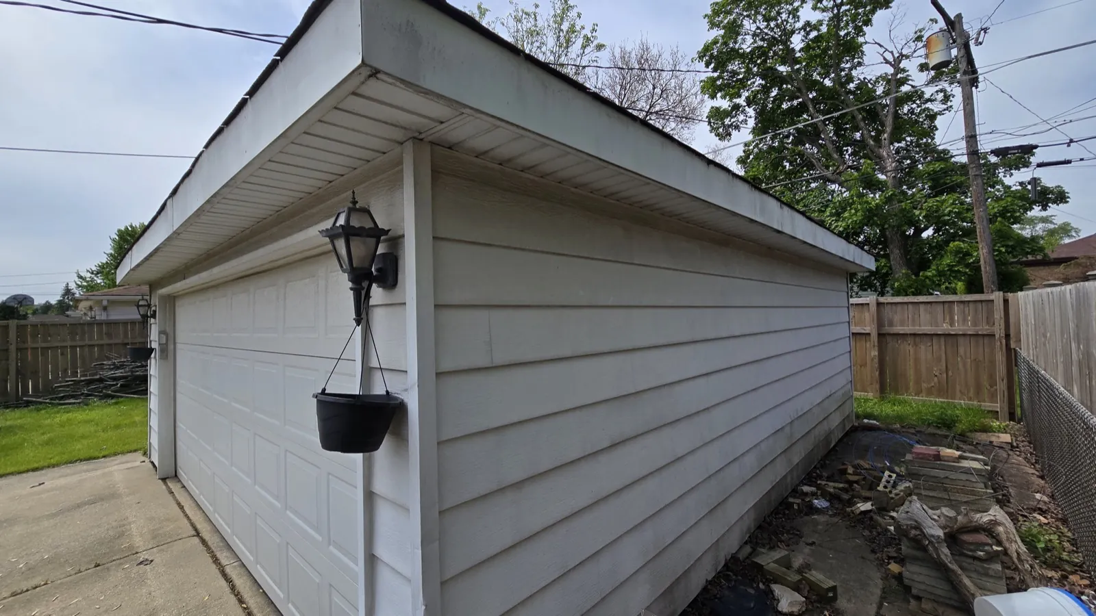 White vinyl siding installed on a garage exterior in Berkeley, IL