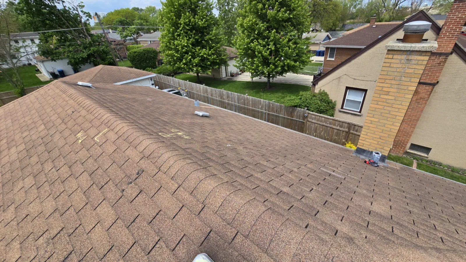 A new asphalt architectural shingle roof installation on a residential home in Berkeley, IL
