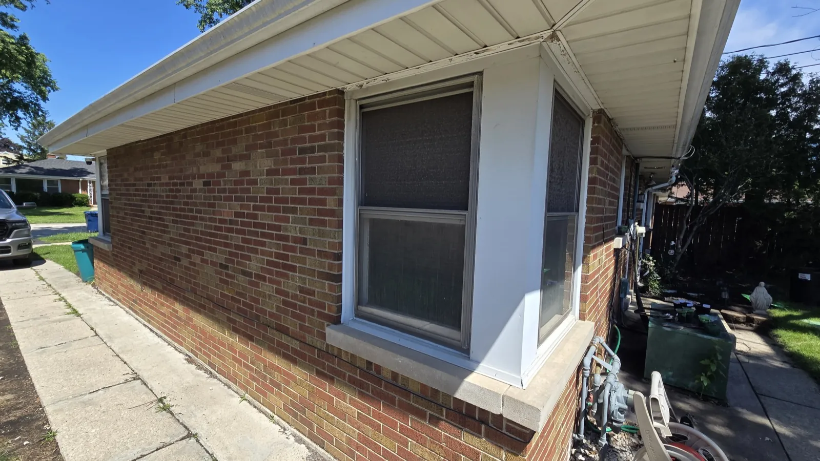 A bay window installed on a brick exterior wall in Berkeley, IL