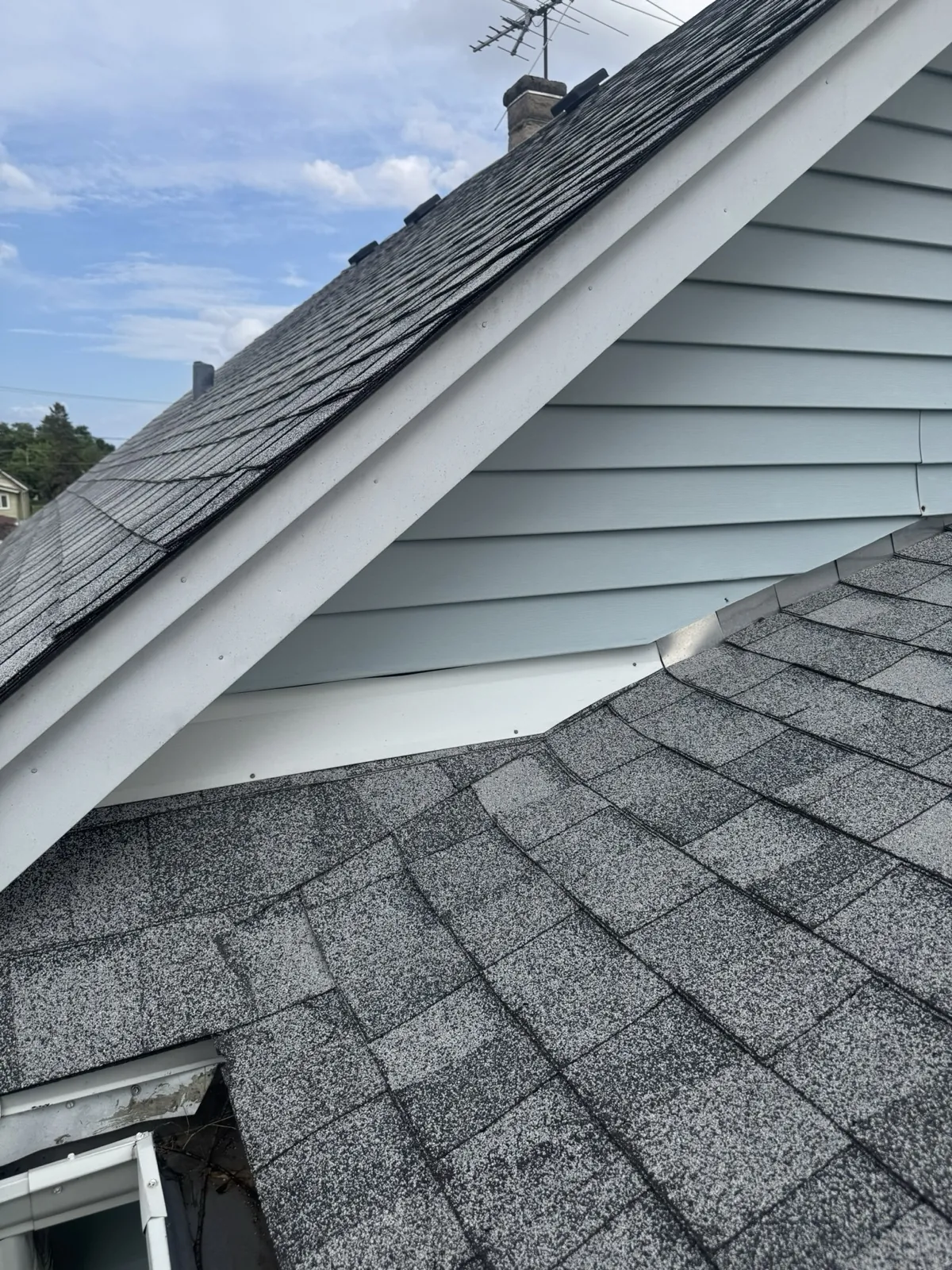 New charcoal architectural shingle roof with white trim and gray siding in Berwyn, IL