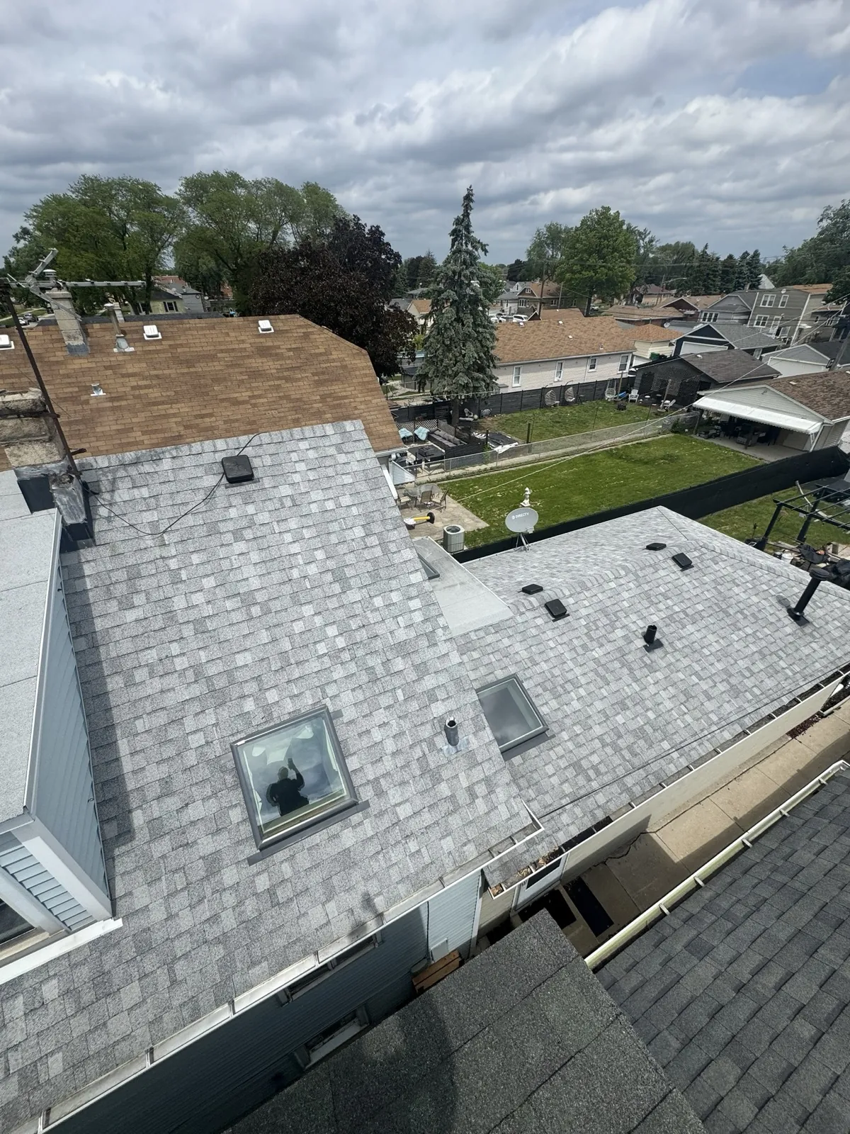 New grey architectural shingle roof on a residential home in Berwyn, IL