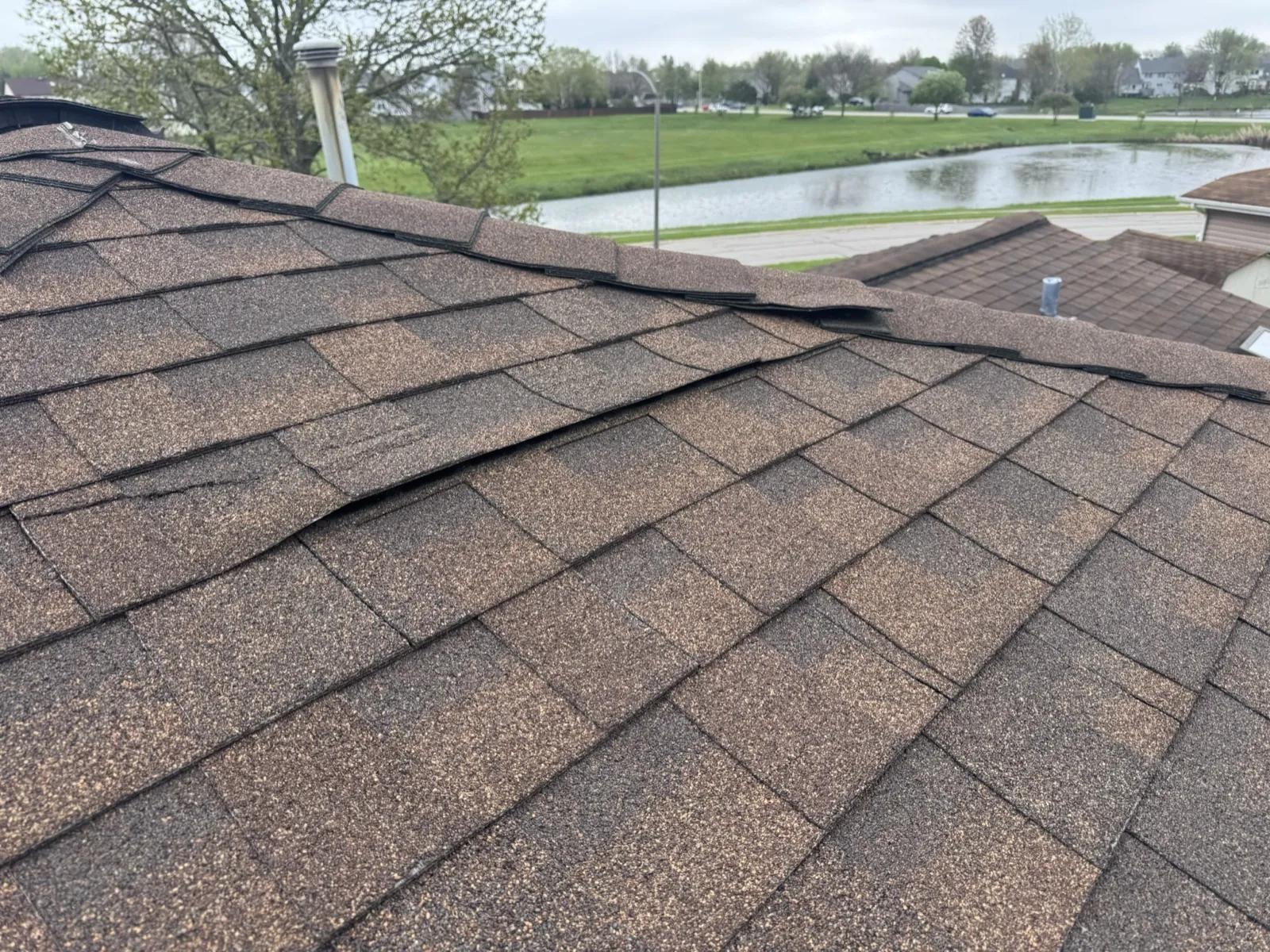 New brown architectural shingle roof on a residential home in Carol Stream, IL