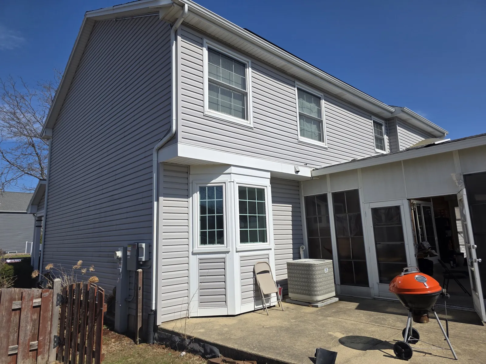 Gray vinyl siding on a two-story residential home in Carol Stream, IL