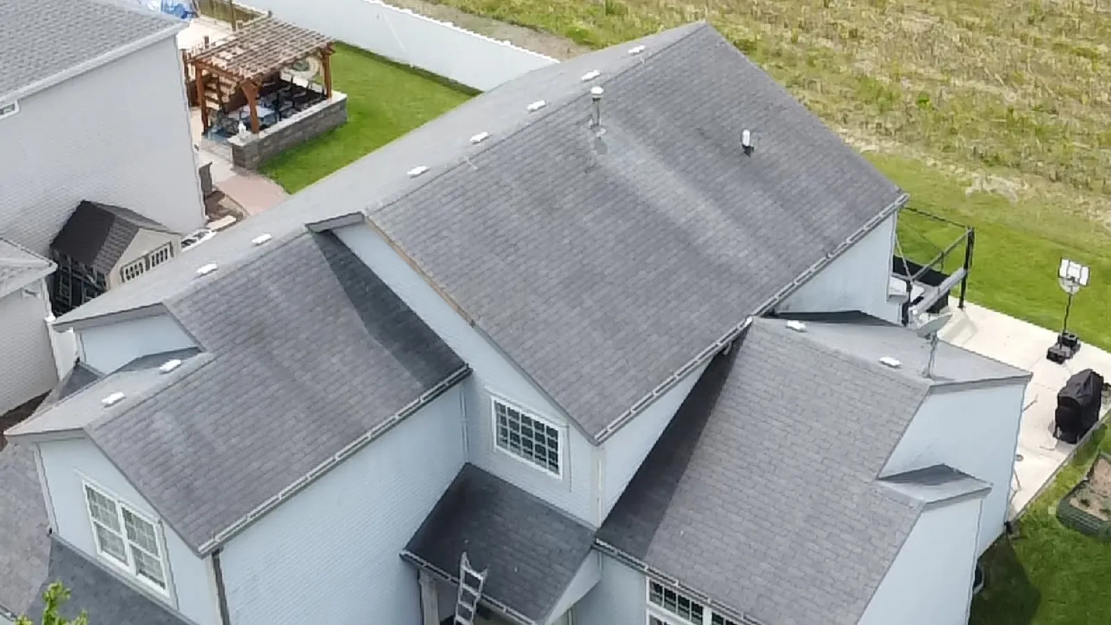 New gray architectural shingle roof on a multi-level home in Crest Hill, IL