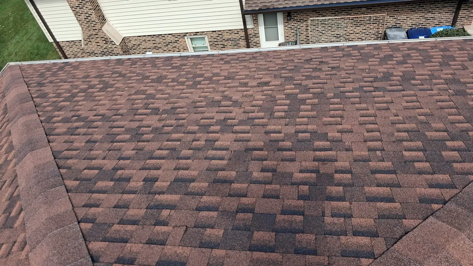 New brown architectural shingle roof on a brick home in Darien, IL