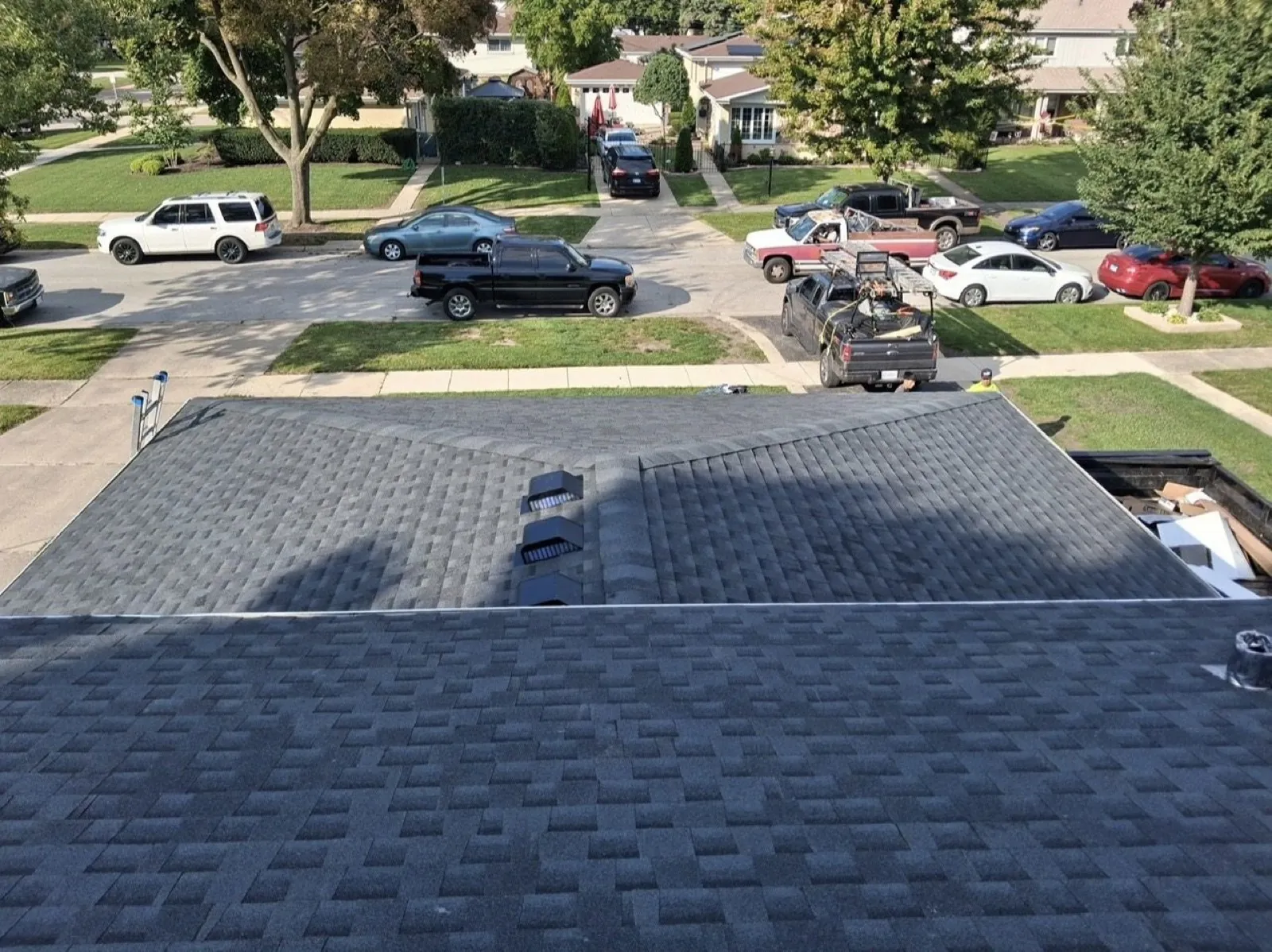 New charcoal architectural shingle roof installation on a residential home in Des Plaines, IL
