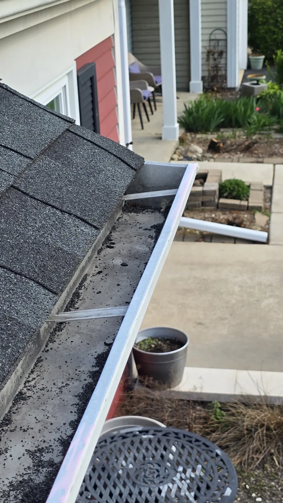 Close-up of a new asphalt shingle roof with a metal edge trim in Downers Grove, IL