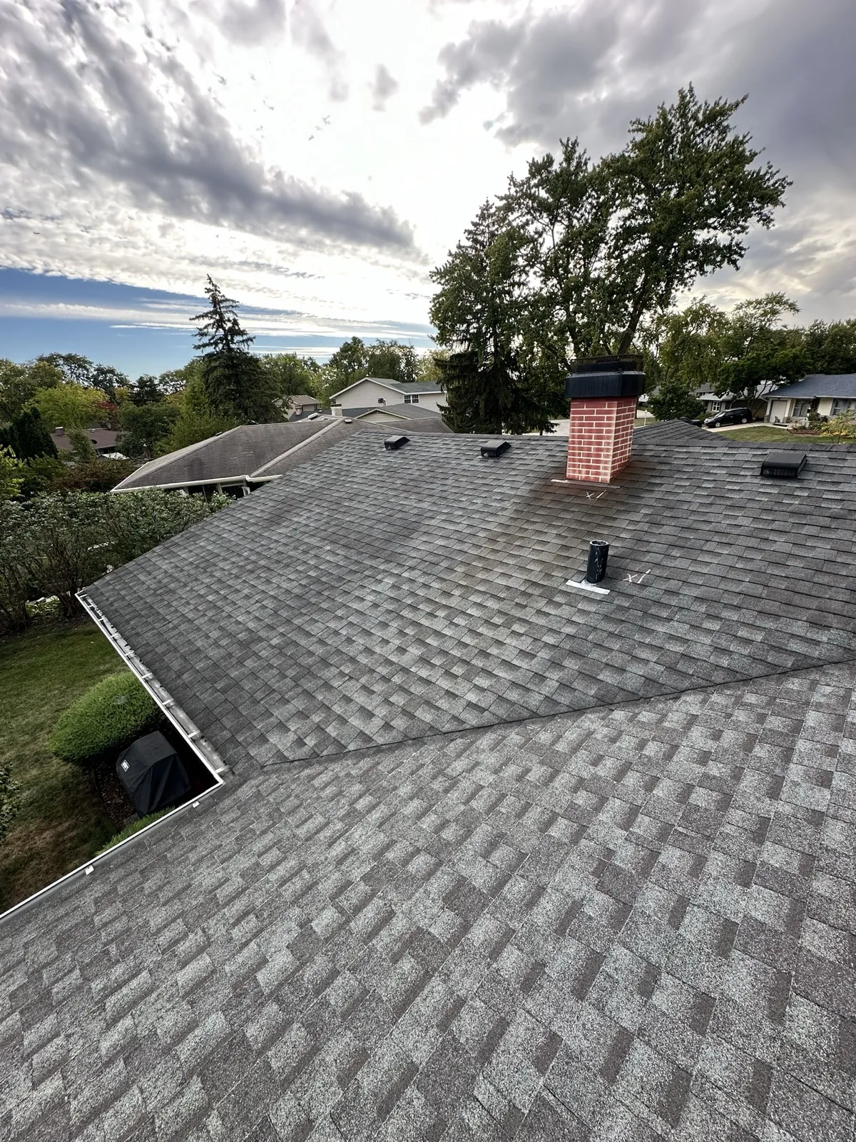 New charcoal gray architectural shingle roof on a residential home in Elk Grove Village, IL