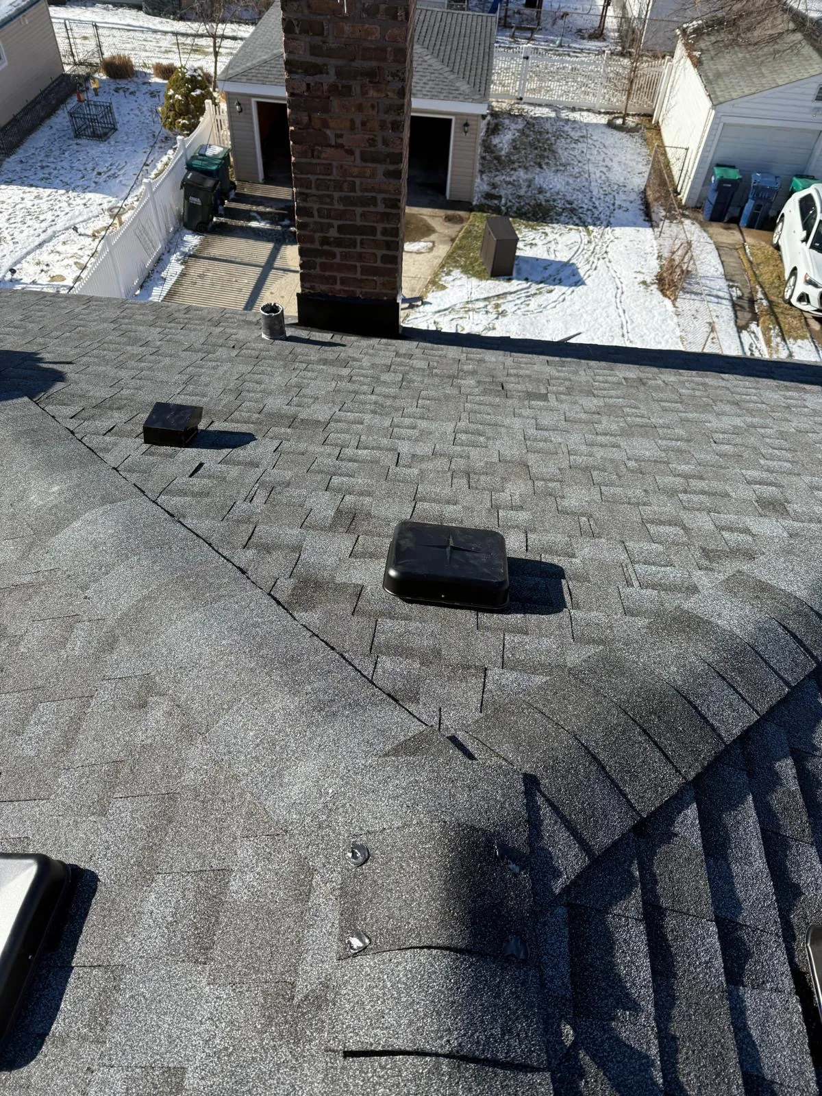 New charcoal architectural shingle roof with installed vents in Evergreen Park, IL