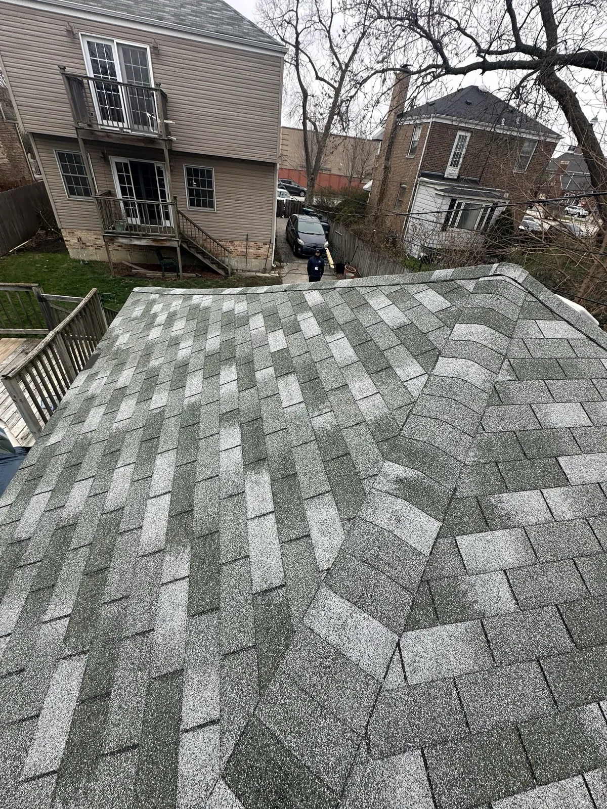 New gray architectural shingle roof on a multi-story home in Evergreen Park, IL