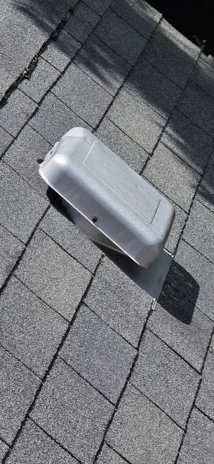 Close-up of a roof vent installed on a gray asphalt shingle roof in Forest Park, IL