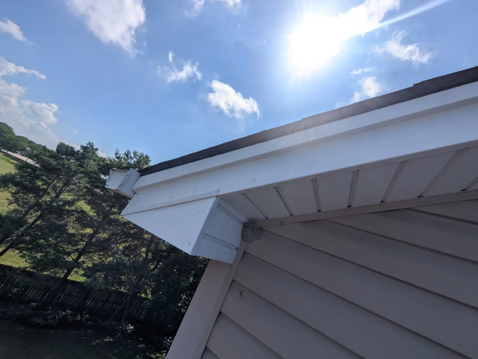New asphalt architectural shingle roof with white trim and soffit in Geneva, IL