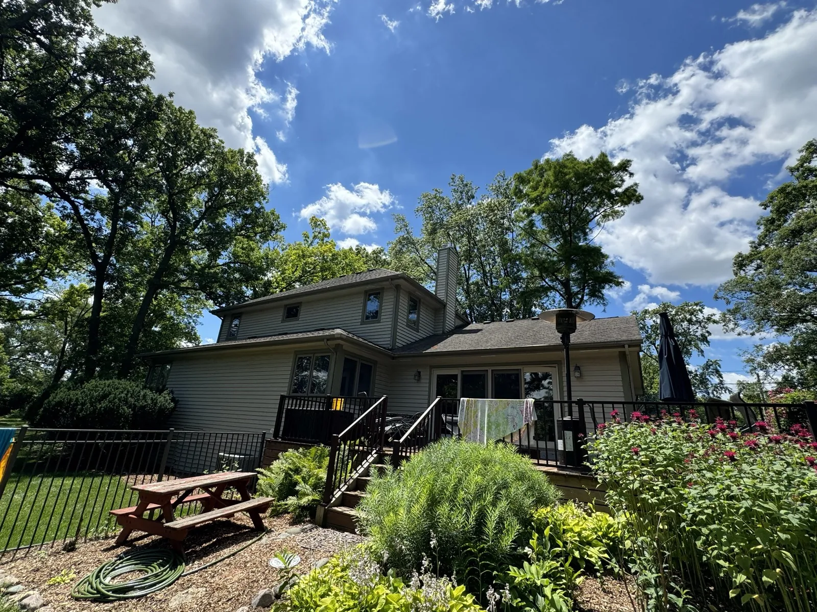 New asphalt architectural shingle roof on a two-story home with siding in Glen Ellyn, IL