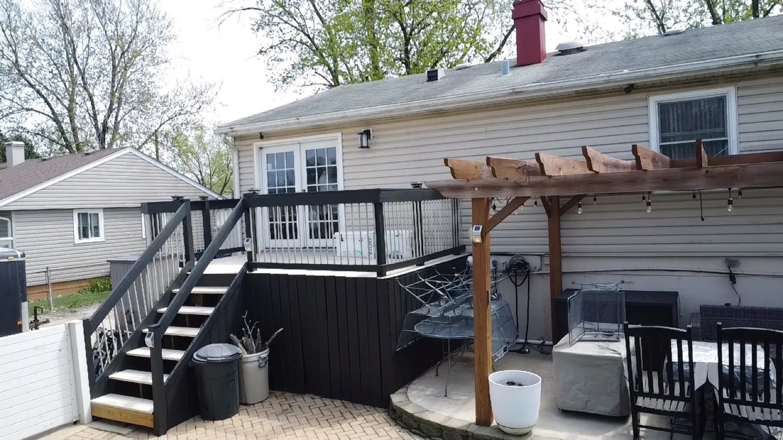A gray asphalt shingle roof on a house with light-colored siding in Glendale Heights, IL