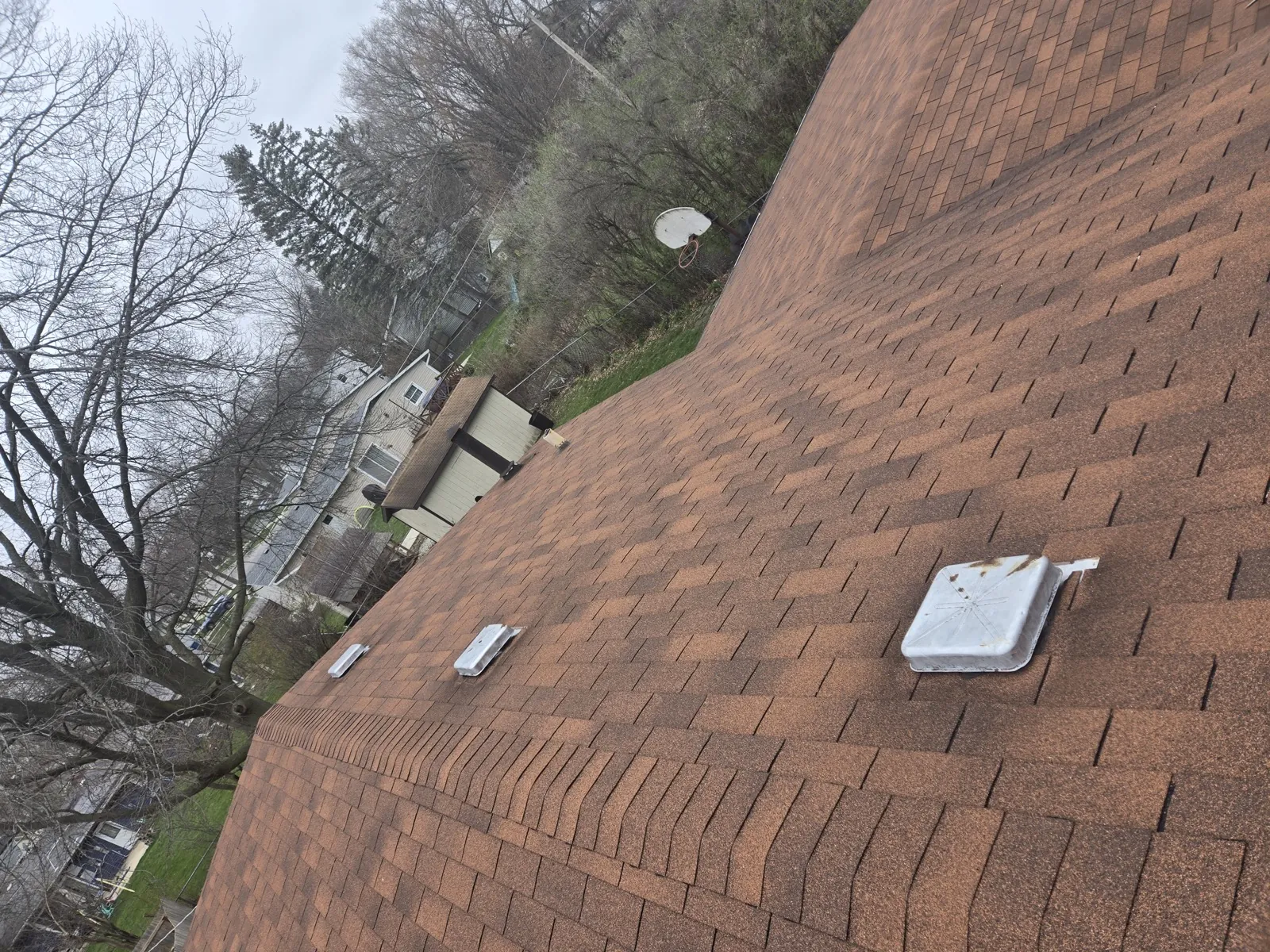 New brown architectural shingle roof on a multi-story home in Hanover Park, IL