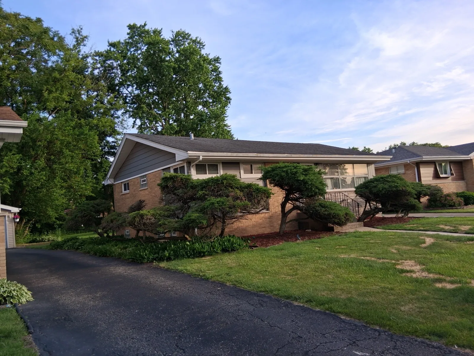 A new asphalt shingle roof on a ranch-style brick home in Hillside, IL