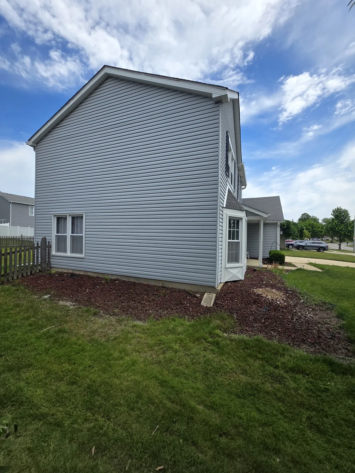 New gray vinyl siding on a two-story home in Hoffman Estates, IL