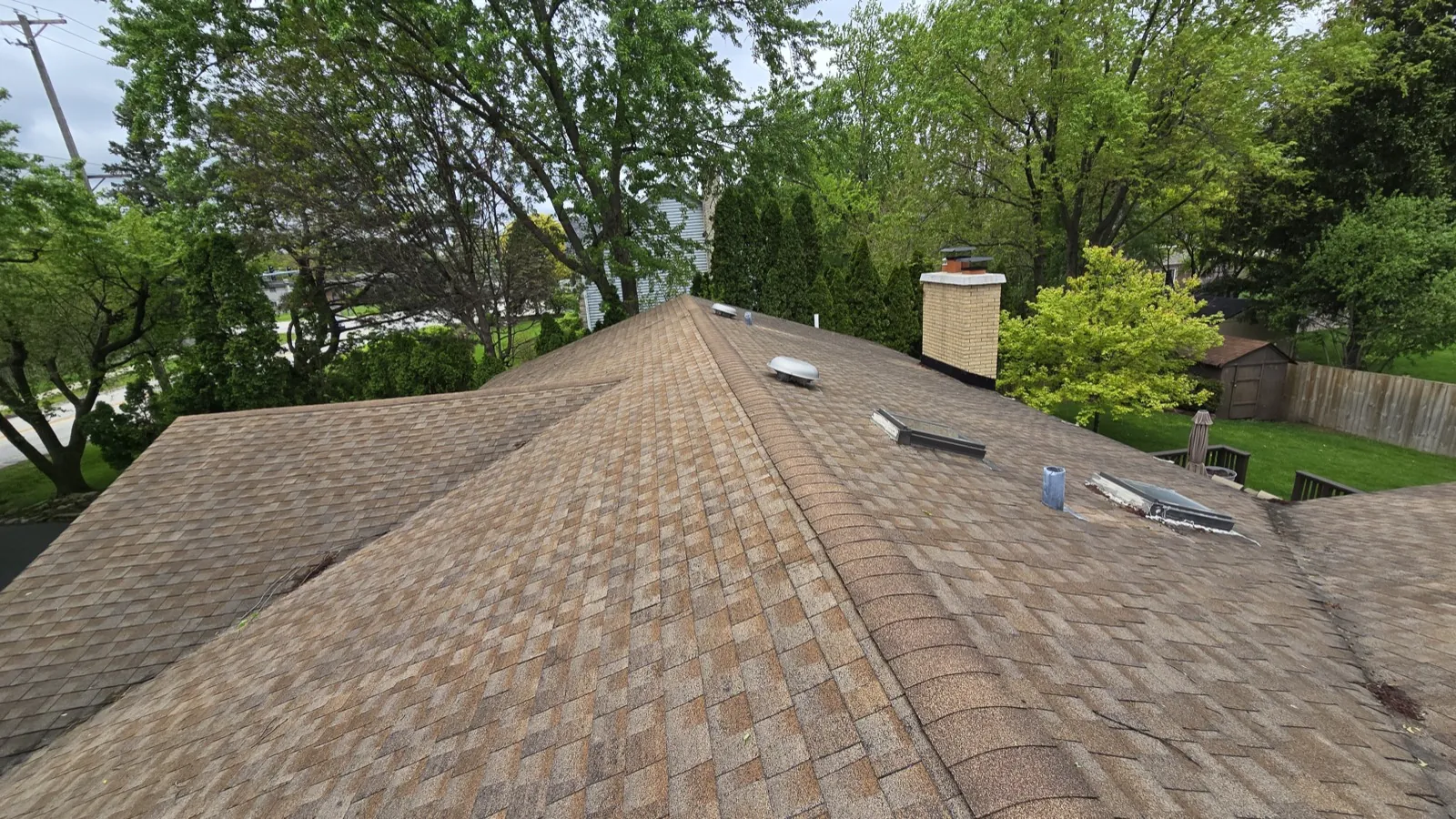 A multi-colored architectural shingle roof on a large residential home in La Grange, IL