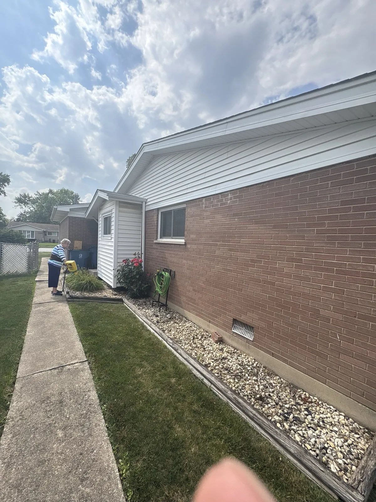 White vinyl siding installed on a brick home exterior in Midlothian, IL