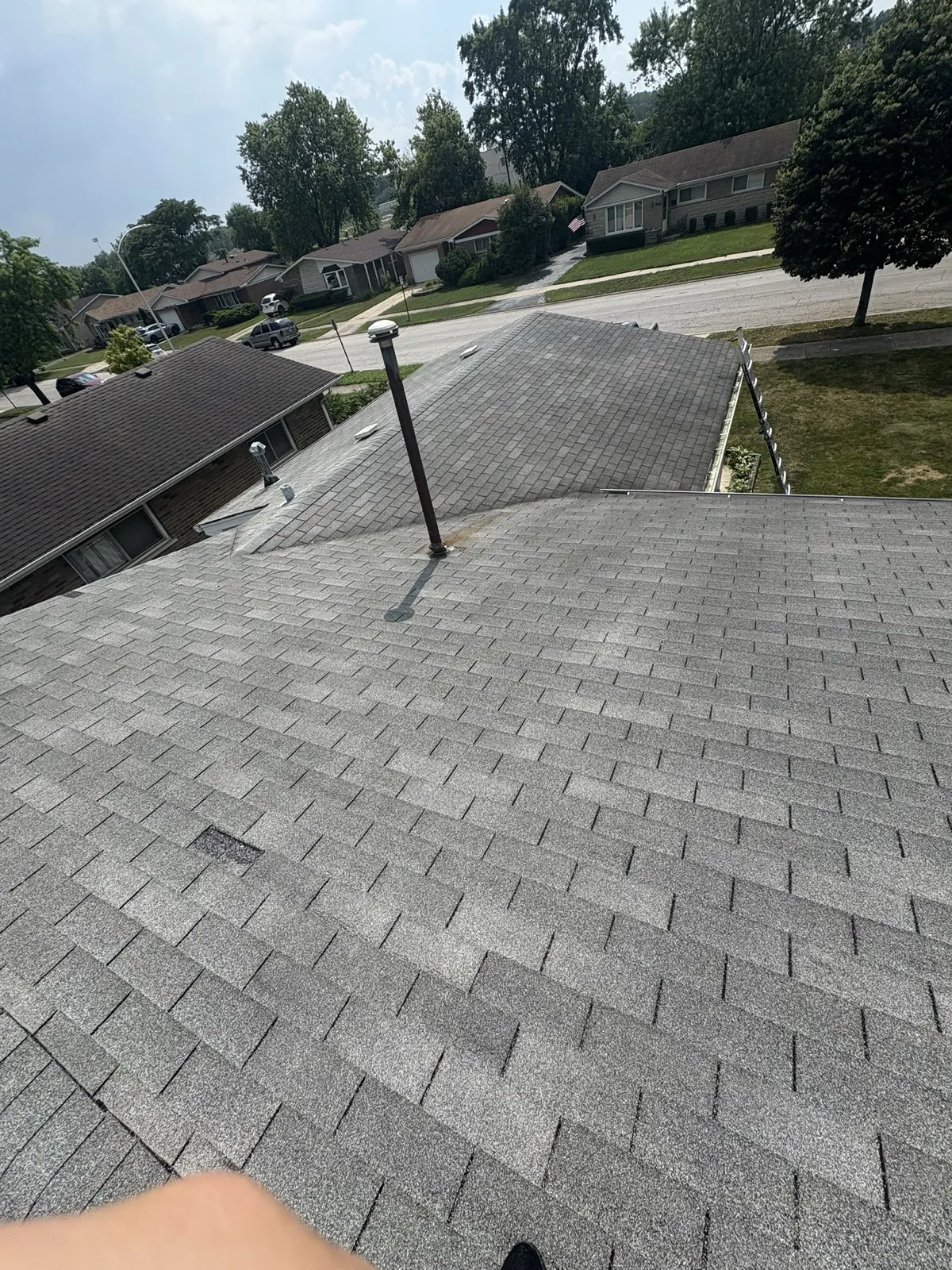New gray architectural shingle roof on a multi-level home in Midlothian, IL