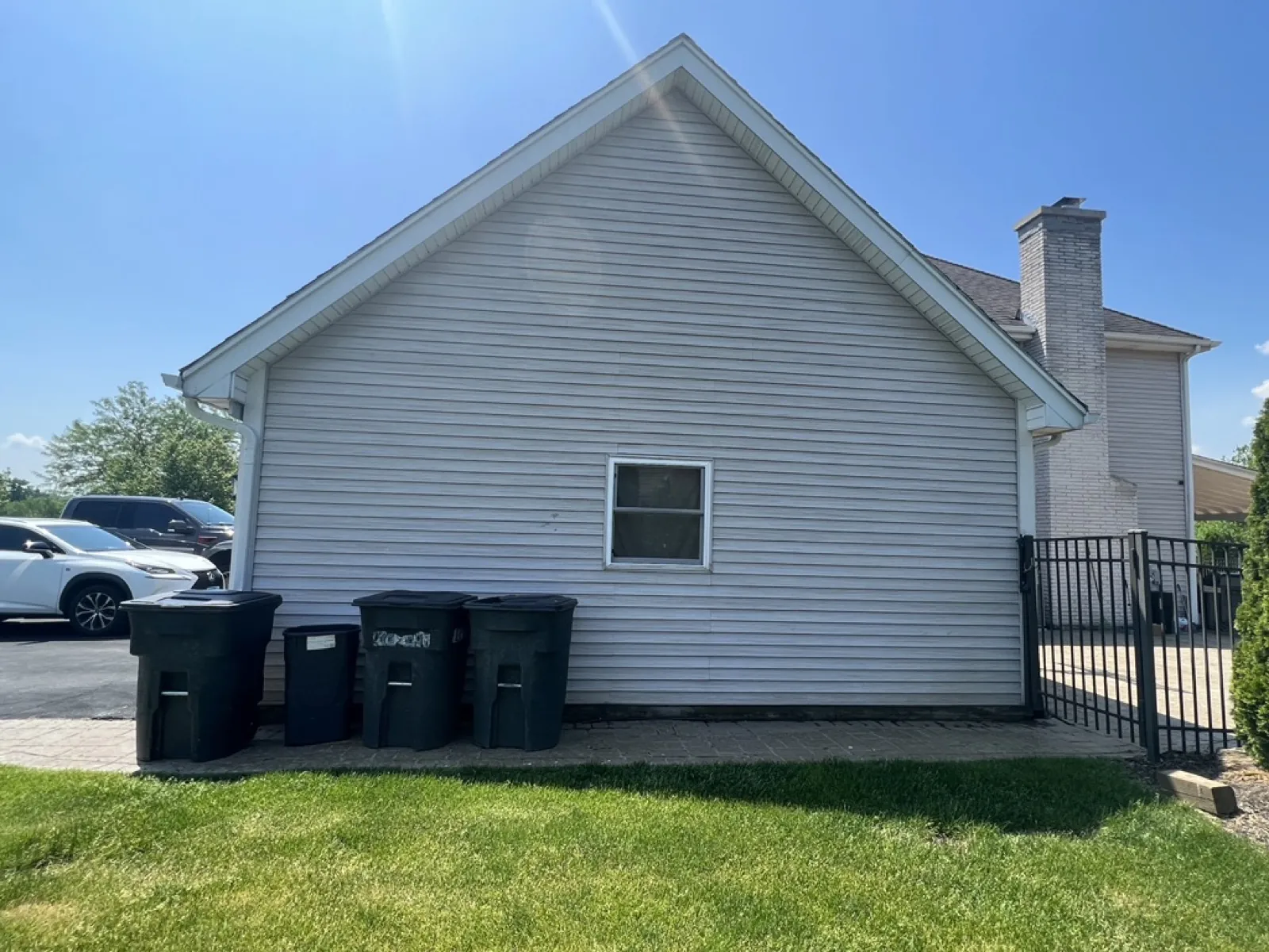 New light gray vinyl siding on a gabled exterior wall in Mokena, IL