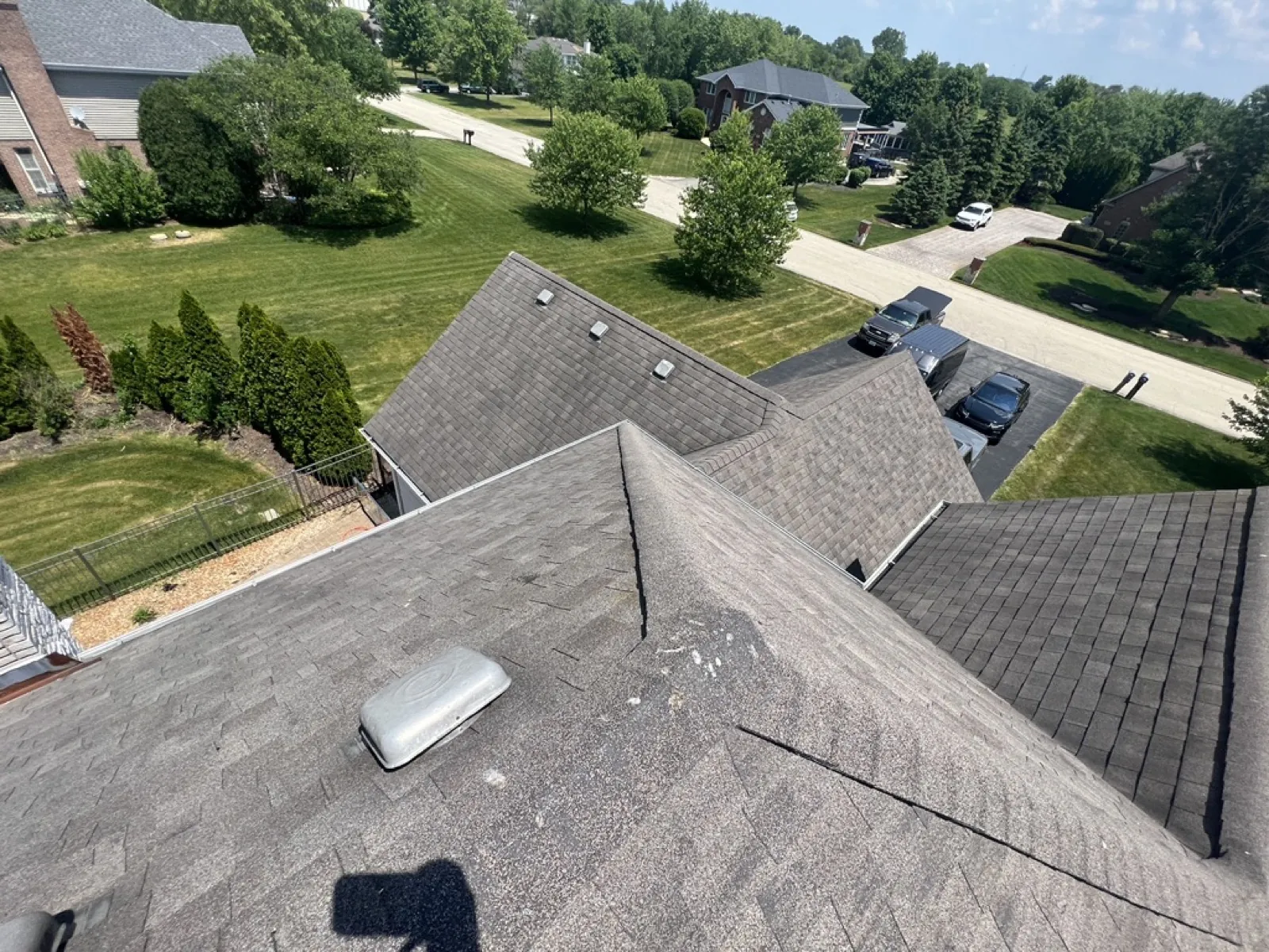 A gray asphalt architectural shingle roof on a multi-gabled home in Mokena, IL