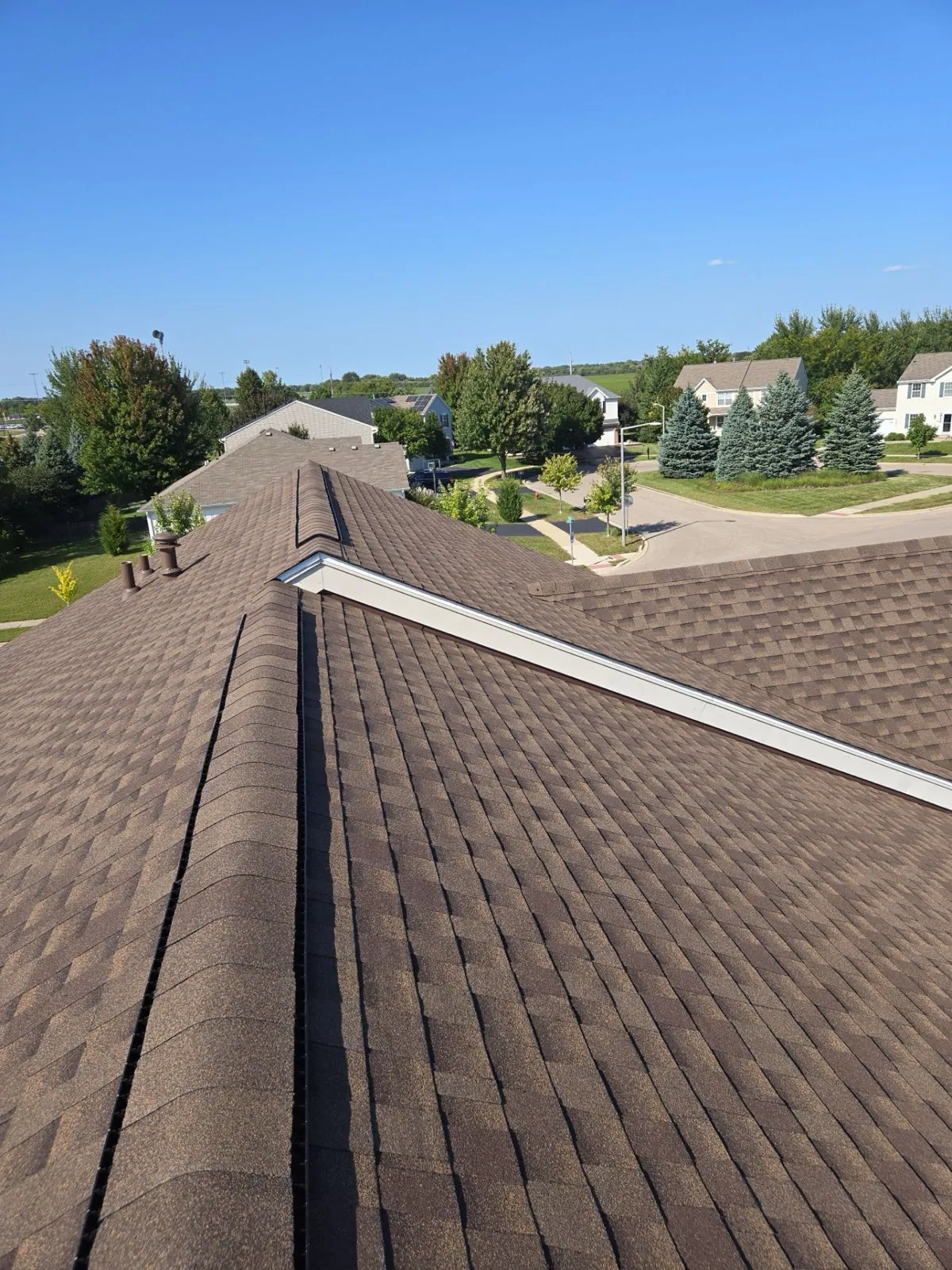 New brown architectural shingle roof on a residential home in Montgomery, IL