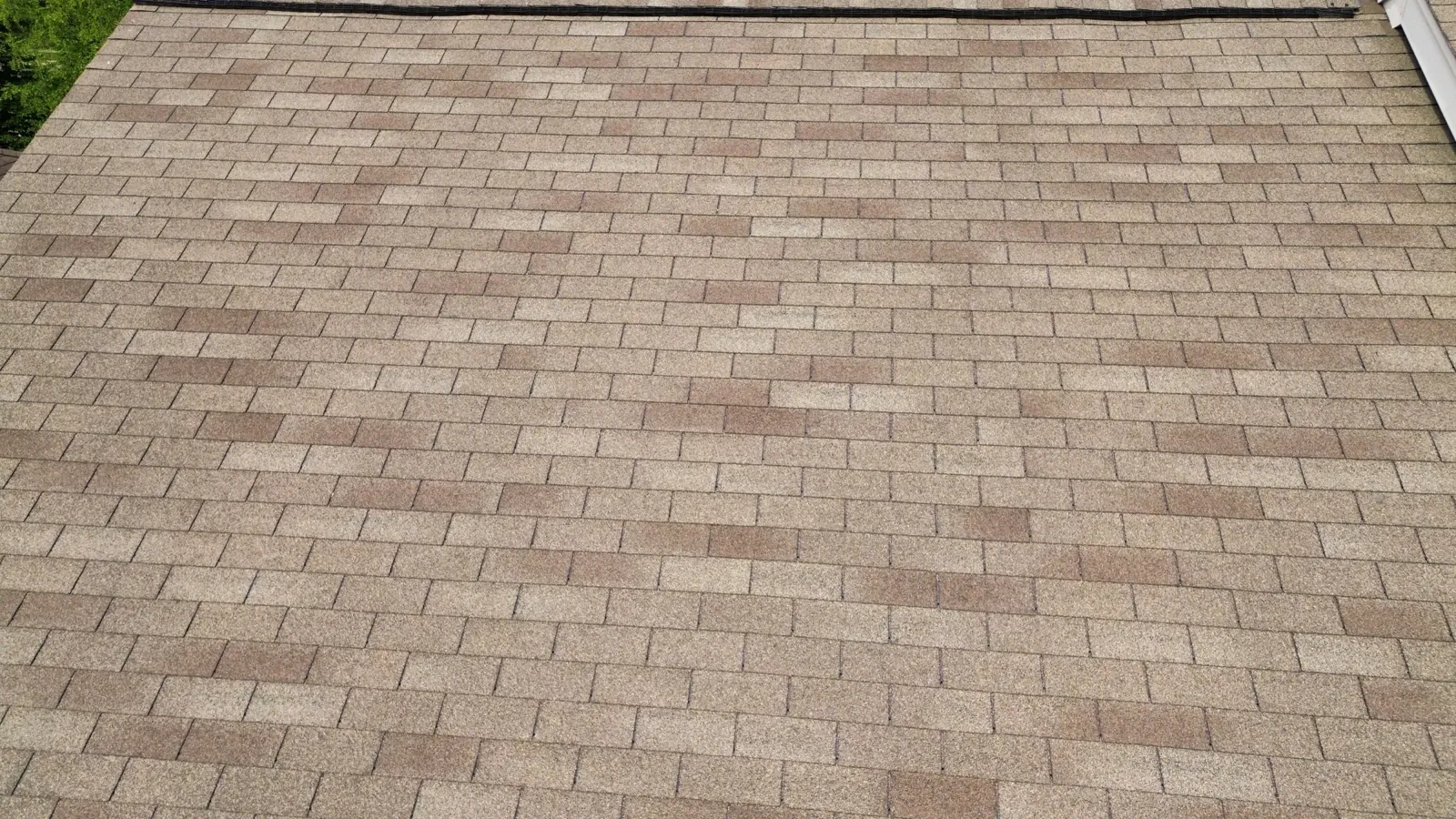 A close-up view of a new multi-toned architectural shingle roof in Montgomery, IL