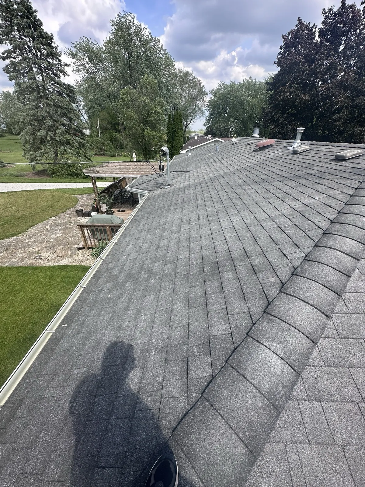 New charcoal gray architectural shingle roof on a residential home in New Lenox, IL