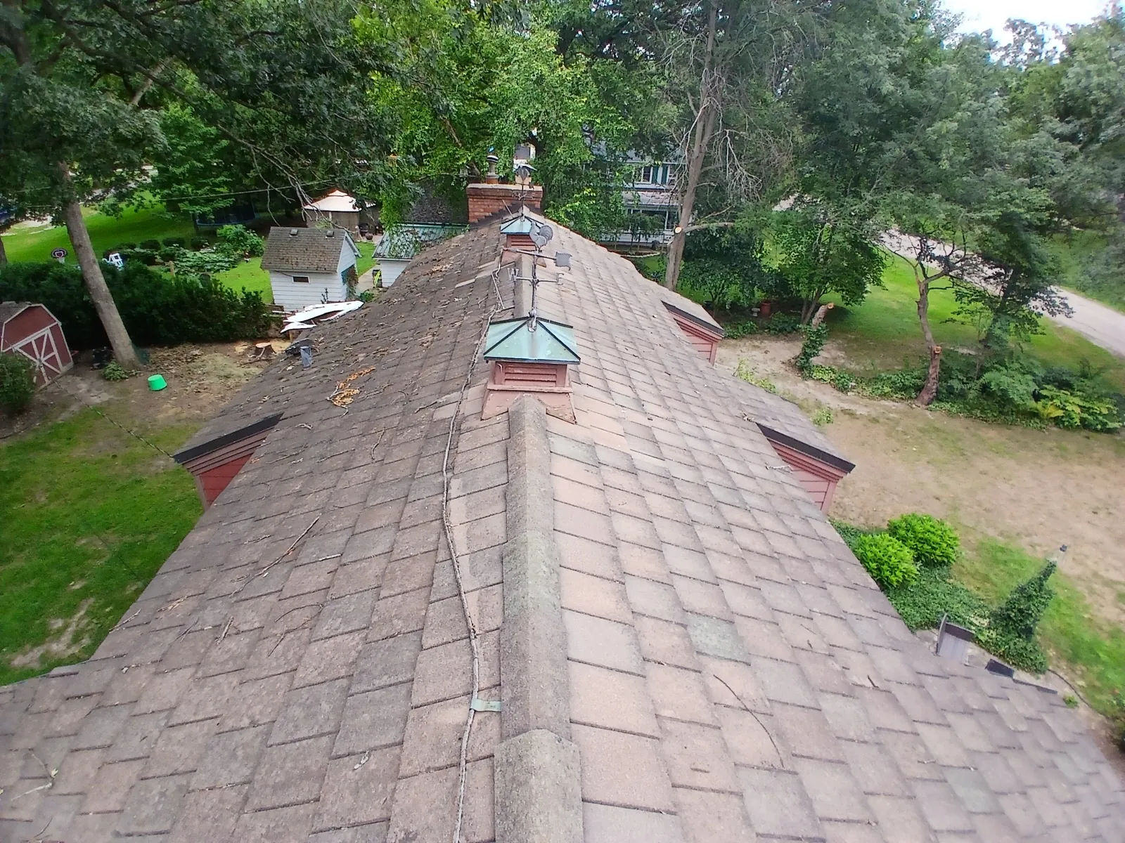 Aerial view of a slate tile roof with copper flashing and dormers in North Aurora, IL