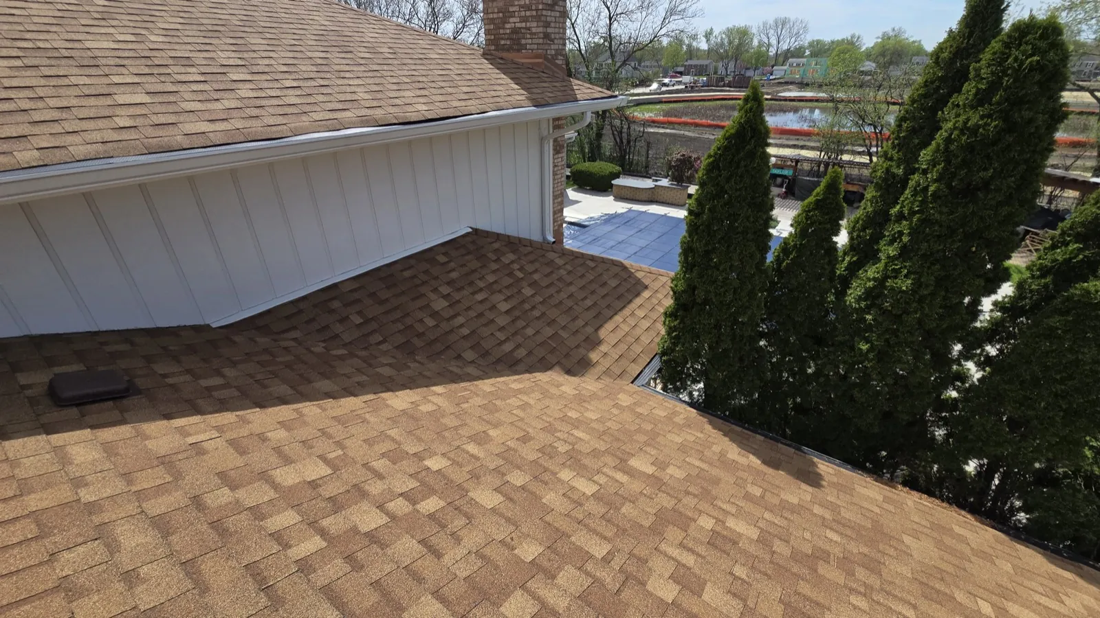 New brown architectural shingle roof on a home with white siding in Oak Brook, IL