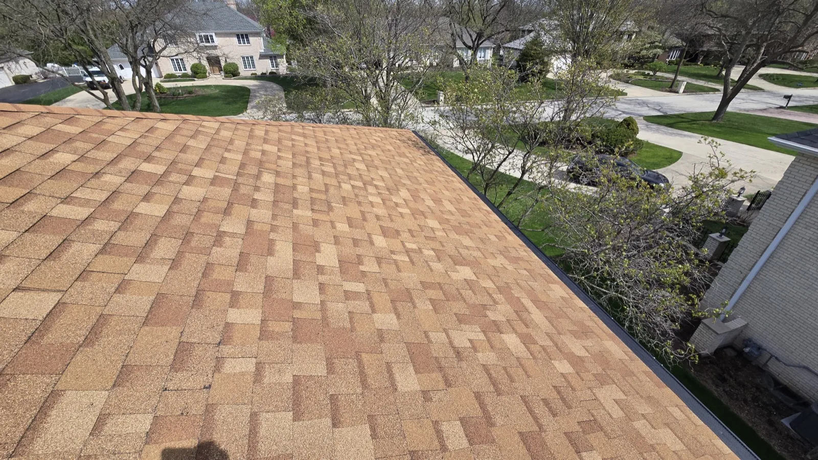 New brown architectural shingle roof on a residential home in Oak Brook, IL