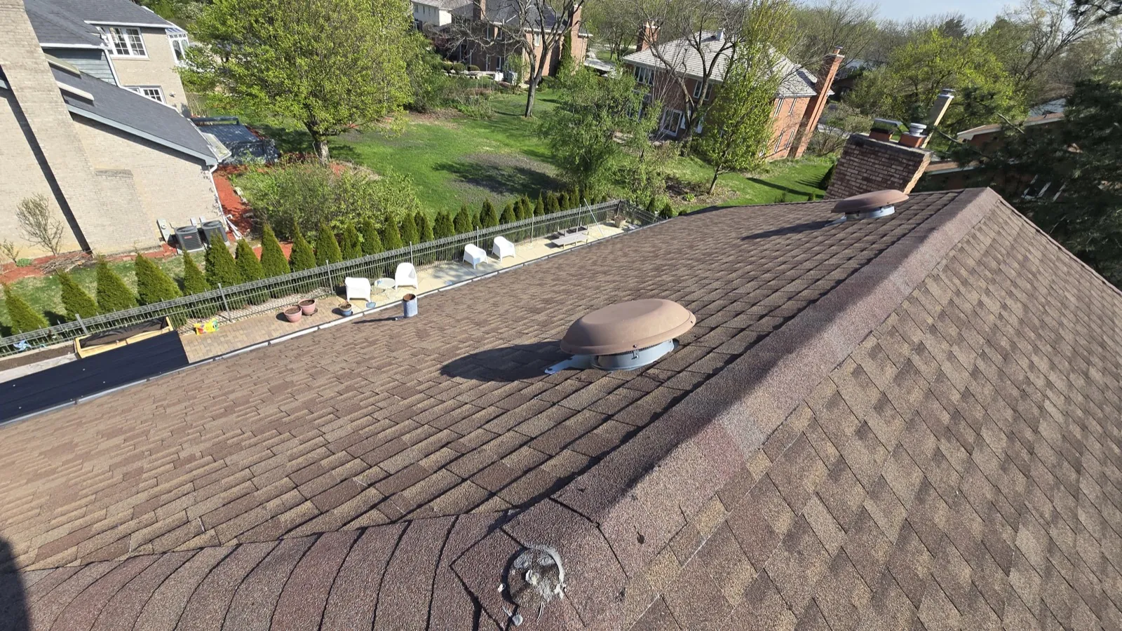 New brown architectural shingle roof with installed vents in Oak Brook, IL