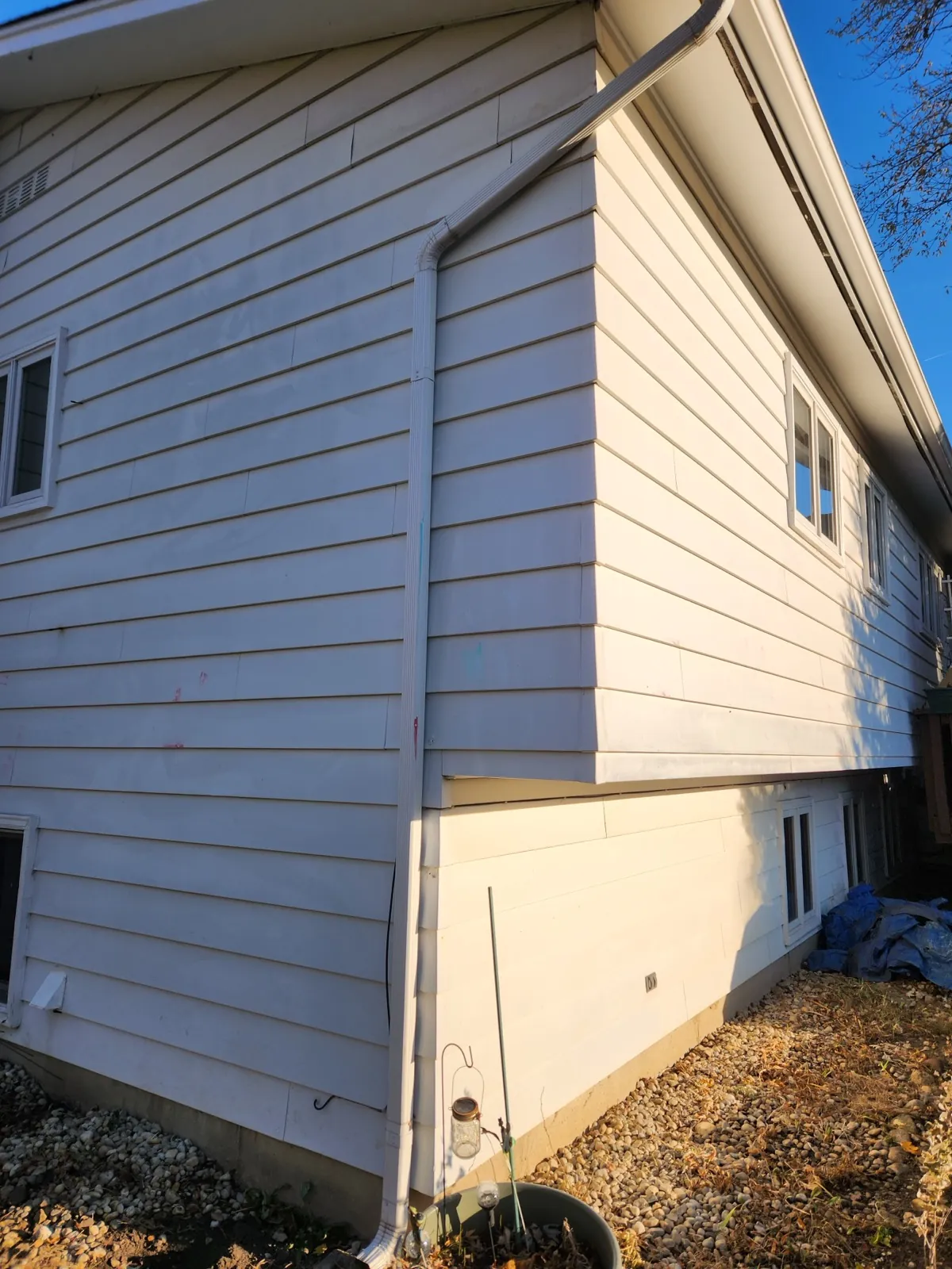 New cream-colored fiber cement siding on a multi-story home in Palatine, IL