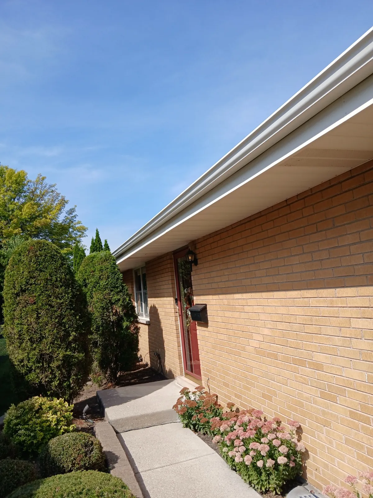 White gutters installed on a brick building in Park Ridge, IL