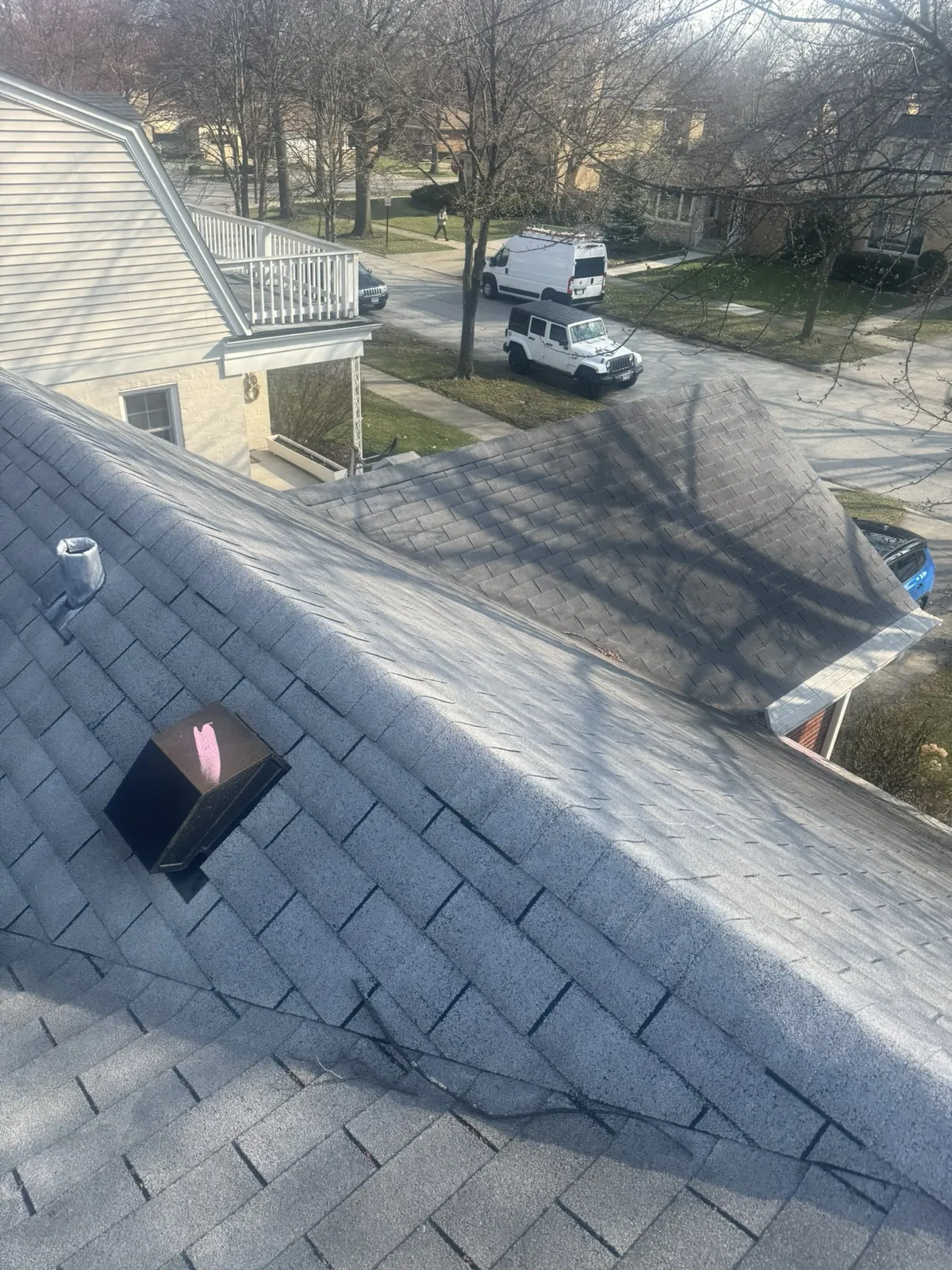 New gray architectural shingle roof on a multi-level home in Park Ridge, IL