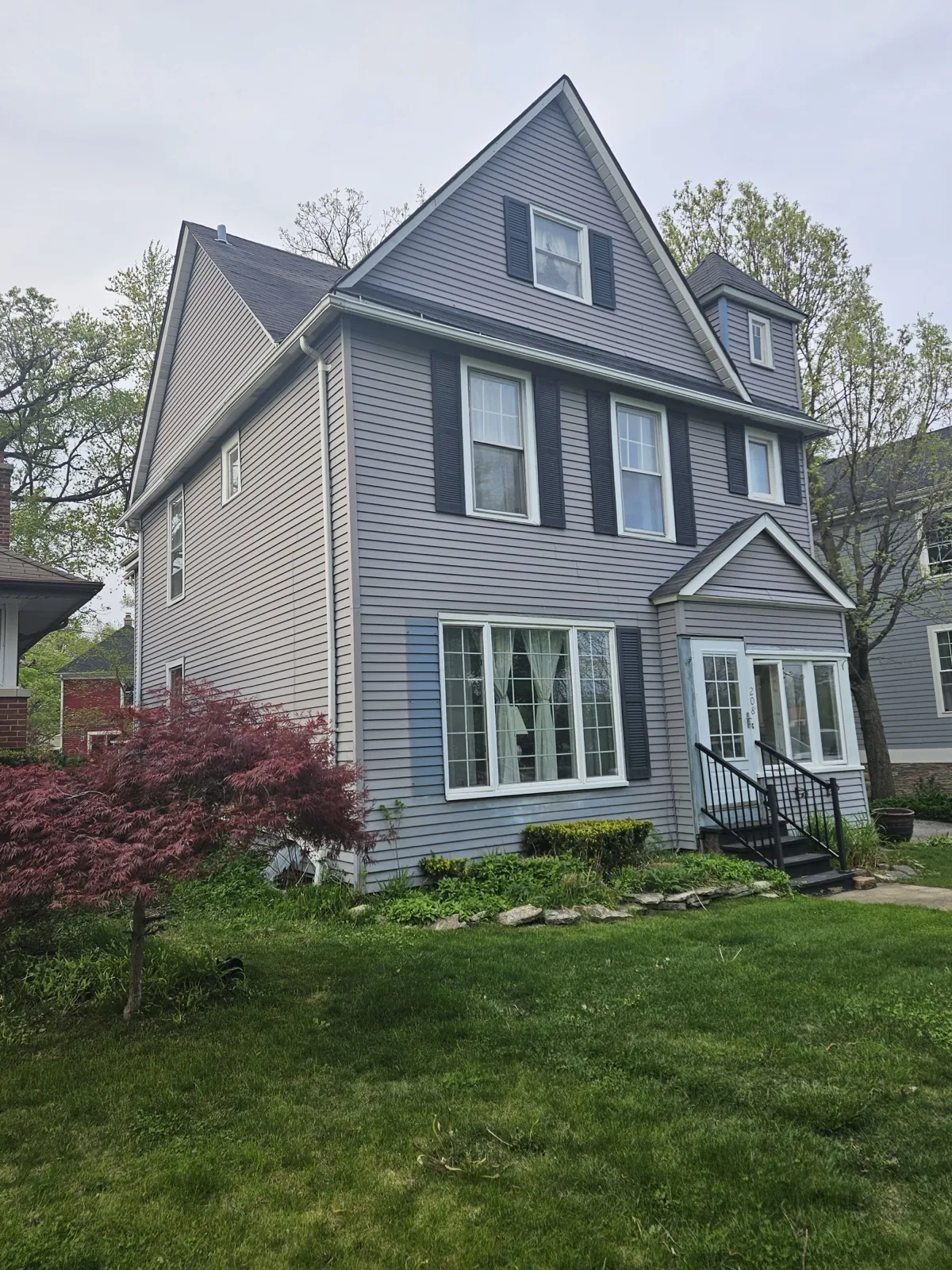 Gray fiber cement siding on a multi-story residential home in Riverside, IL
