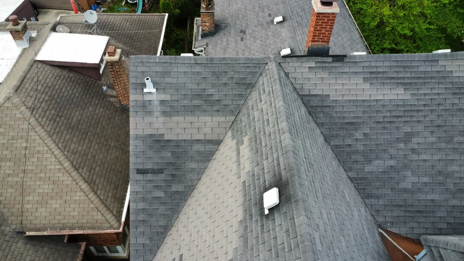 Aerial view of a new charcoal gray architectural shingle roof in Riverside, IL