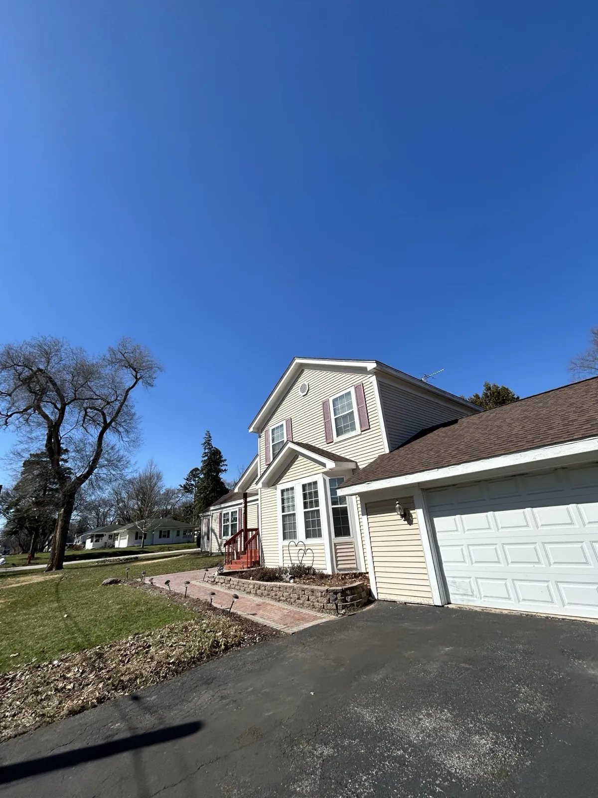 New asphalt architectural shingle roof on a two-story home with a garage in St. Charles, IL