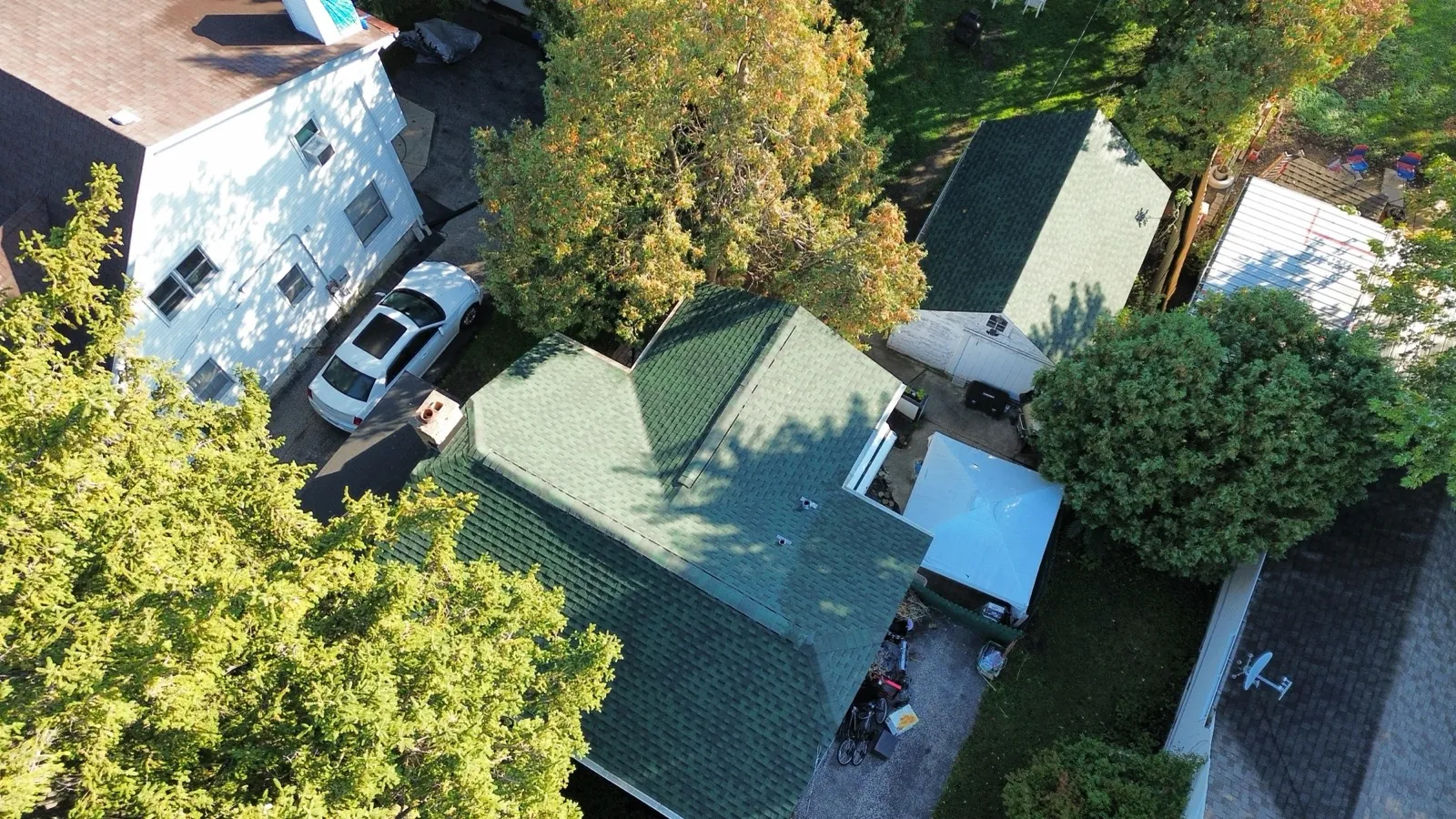 Aerial view of a green asphalt architectural shingle roof on a residential home in Villa Park, IL