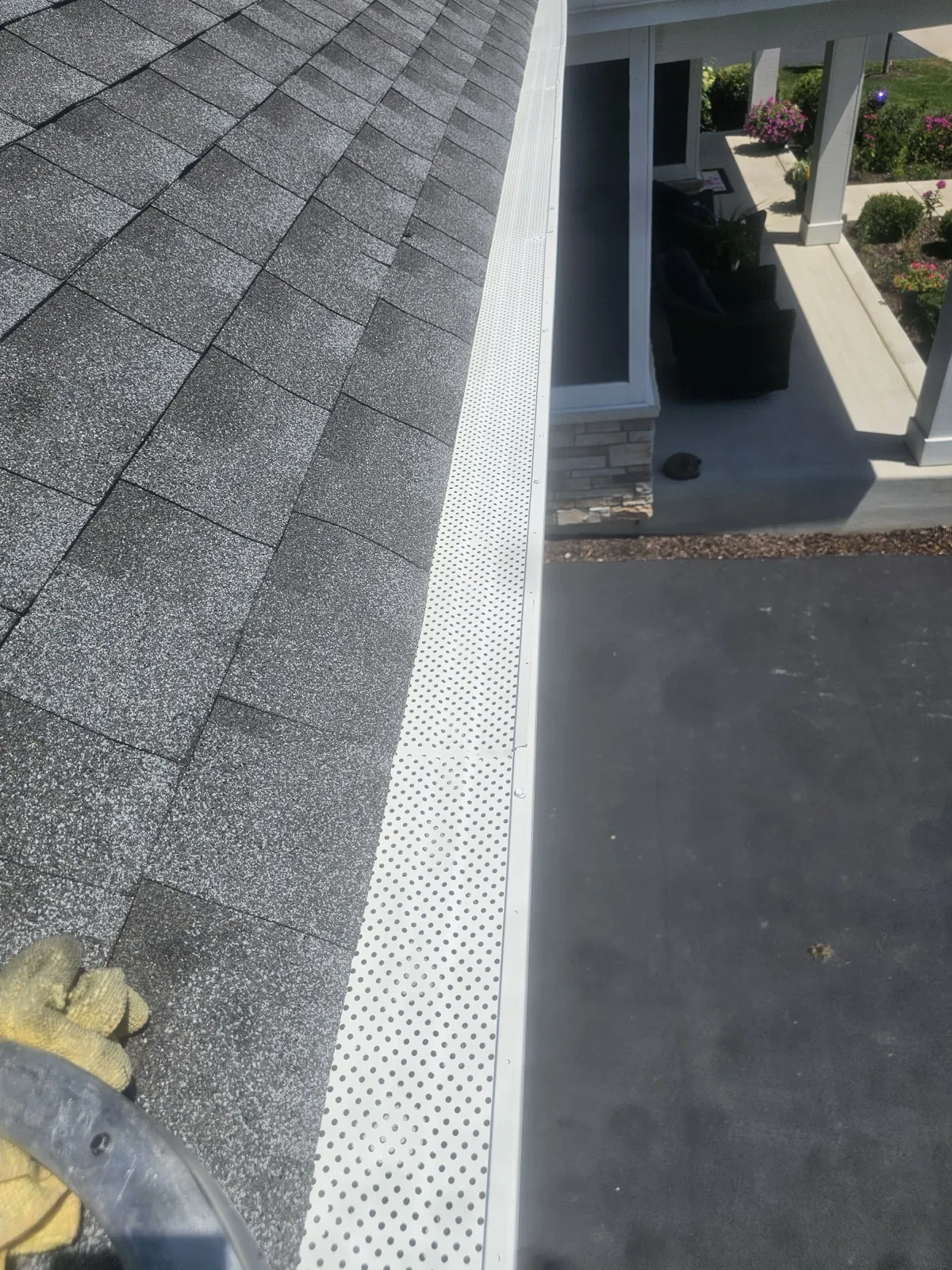 New charcoal architectural shingle roof with a white gutter system in Warrenville, IL